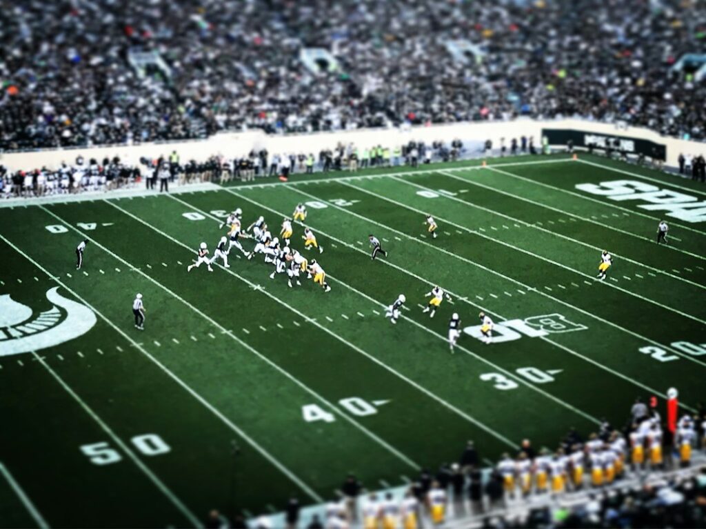Amerikan futbolunda pas oyunu; Buffalo Bills-Los Angeles Rams maçından değildir.